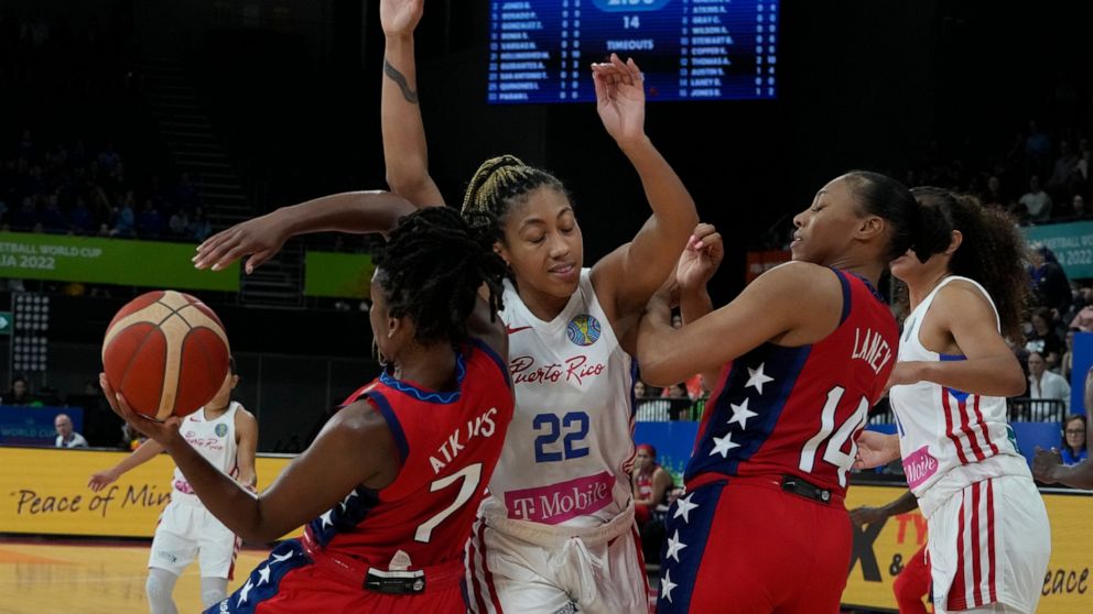 United States' Ariel Atkins keeps the ball away from Puerto Rico's Arella Guirantes at the women's Basketball World Cup in Sydney, Australia, Friday, Sept. 23, 2022. (AP Photo/Mark Baker)