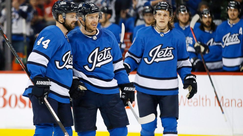 Winnipeg Jets' Josh Morrissey (44), Bryan Little (18) and Sami Niku (83) celebrate Little's goal against the Detroit Red Wings during the second period of an NHL hockey game Friday, Jan. 11, 2019, in Winnipeg, Manitoba. (John Woods/The Canadian Press