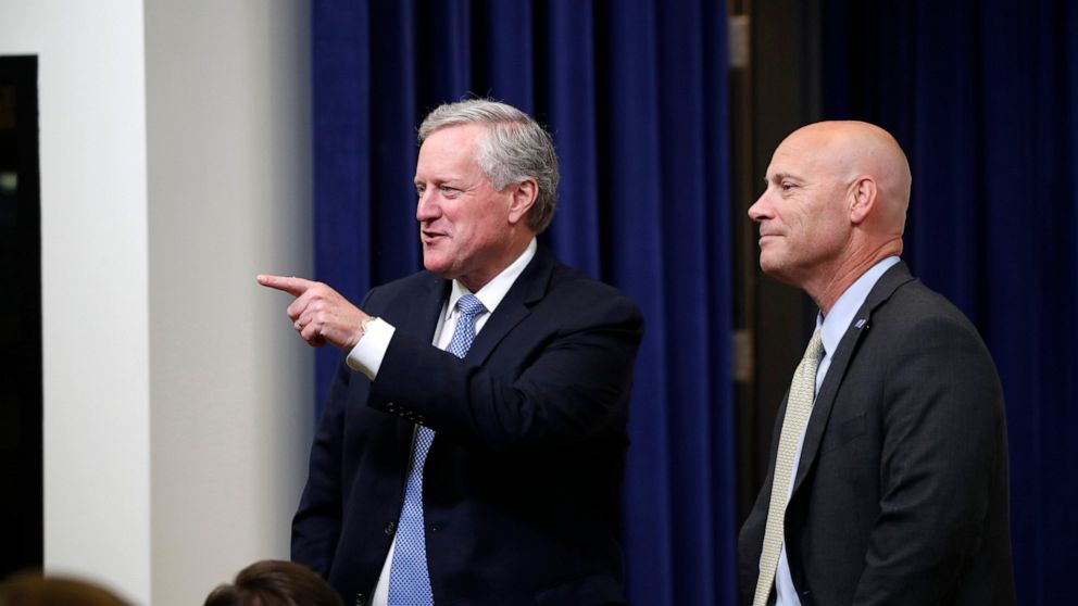 White House chief of staff Mark Meadows, left, and Vice President Mike Pence's chief of staff Marc Short speak before an event with President Donald Trump to sign executive orders on lowering drug prices, in the South Court Auditorium in the White Ho