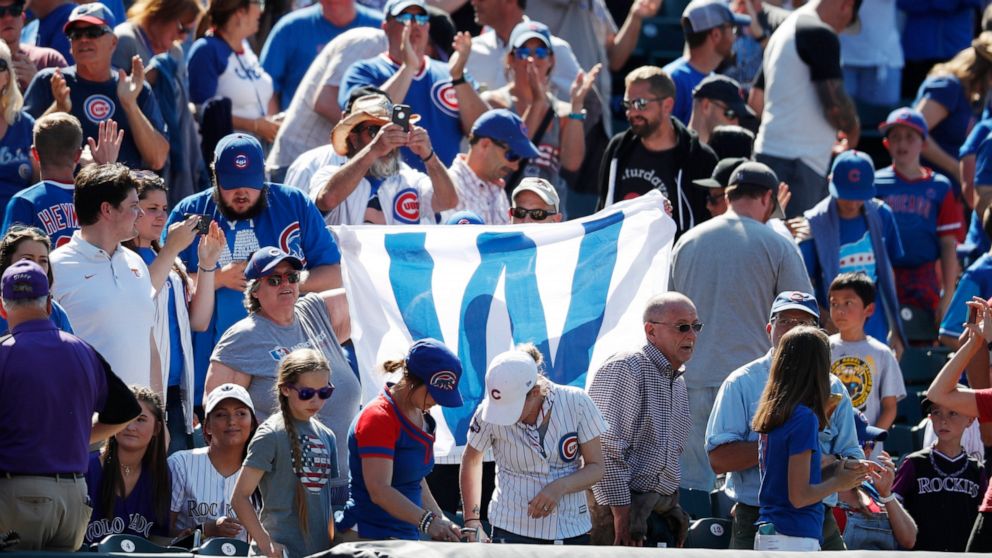 Cubs fans with victory flag, r m