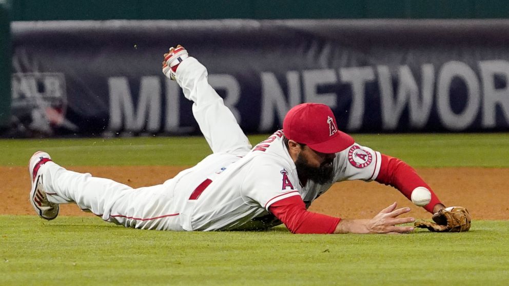 Los Angeles Angels third baseman Anthony Rendon dives for a ball that was hit for a single by New York Mets' Luis Guillorme during the eighth inning of a baseball game Friday, June 10, 2022, in Anaheim, Calif. (AP Photo/Mark J. Terrill)