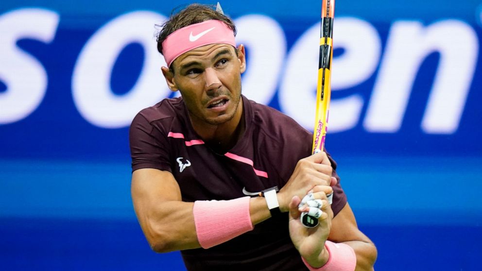 Rafael Nadal, of Spain, wearing a bandage on his nose, returns a shot to Fabio Fognini, of Italy, during the second round of the U.S. Open tennis championships, Friday, Sept. 2, 2022, in New York. (AP Photo/Frank Franklin II)