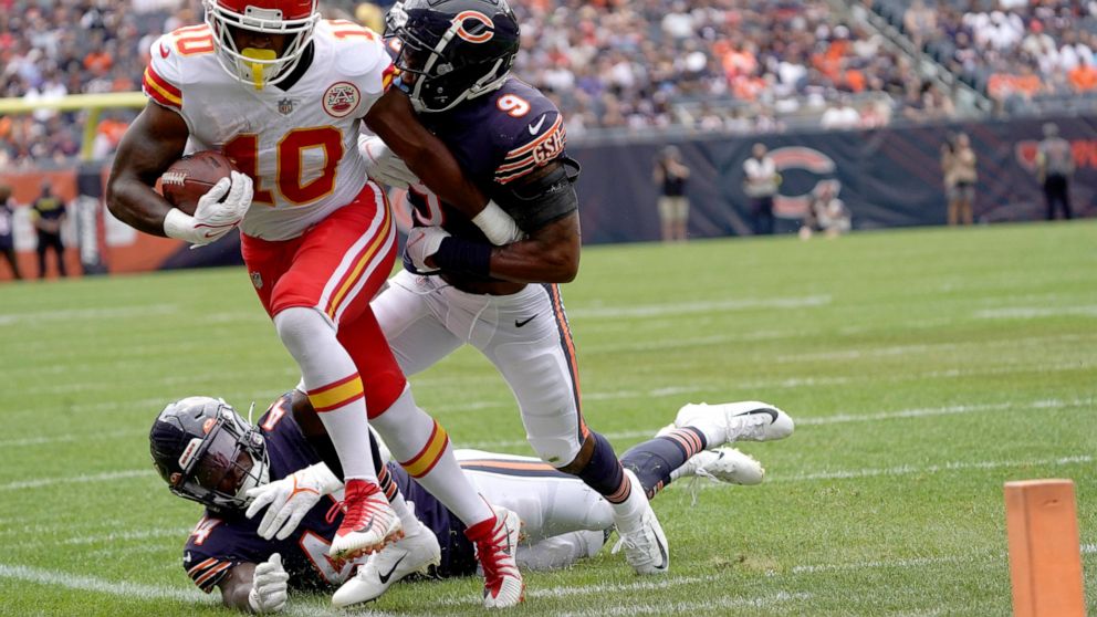 Kansas City Chiefs running back Isiah Pacheco is driven out of bounds near the goal line by Chicago Bears safety Jaquan Brisker in the first half of an NFL preseason football game Saturday, Aug. 13, 2022, in Chicago. (AP Photo/David Banks)