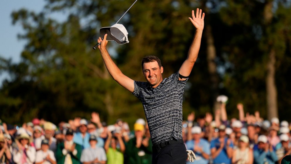FILE - Scottie Scheffler celebrates after winning the 86th Masters golf tournament on Sunday, April 10, 2022, in Augusta, Ga. Scheffler is set to play his hometown Byron Nelson for the first time since winning the Masters. (AP Photo/Matt Slocum, File)