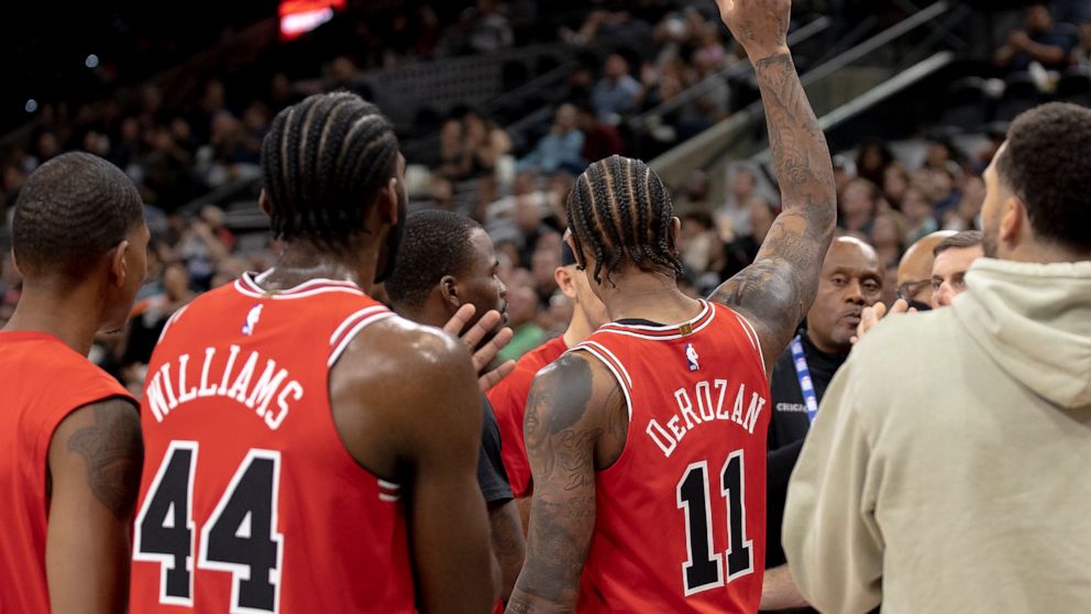 Chicago Bulls forward DeMar DeRozan (11) gestures to the crowd after scoring his 20,000th career point during the first half of an NBA basketball game against the San Antonio Spurs, Friday, Oct. 28, 2022, in San Antonio. (AP Photo/Nick Wagner)