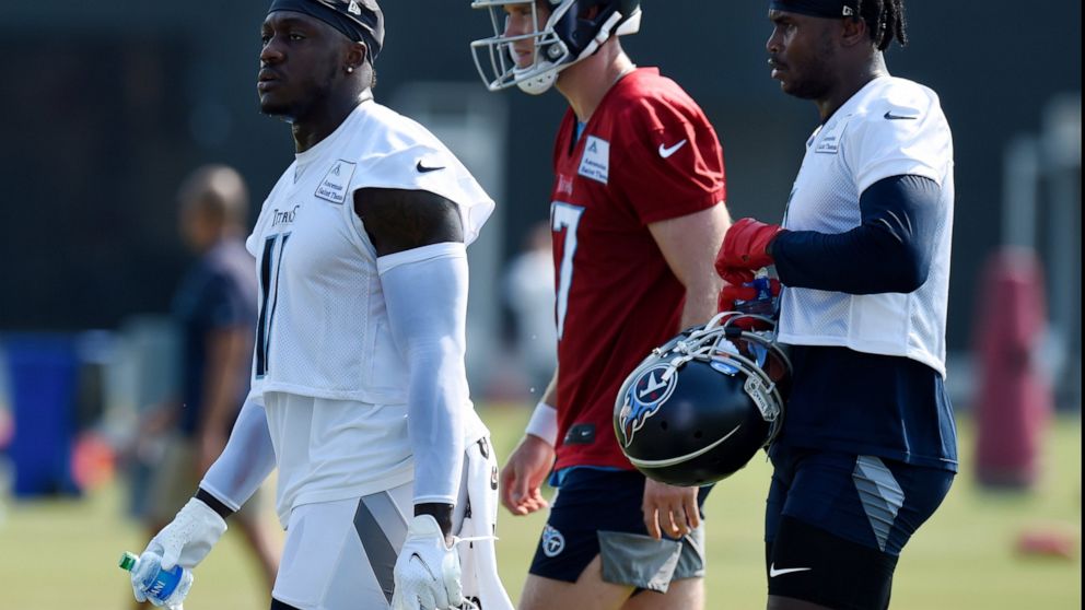 FILE - Tennessee Titans wide receiver A.J. Brown (11), quarterback Ryan Tannehill (17) and Julio Jones (2) take a break during NFL football training camp in Nashville, Tenn., in this Wednesday, July 28, 2021, file photo. Wide receiver A.J. Brown camp