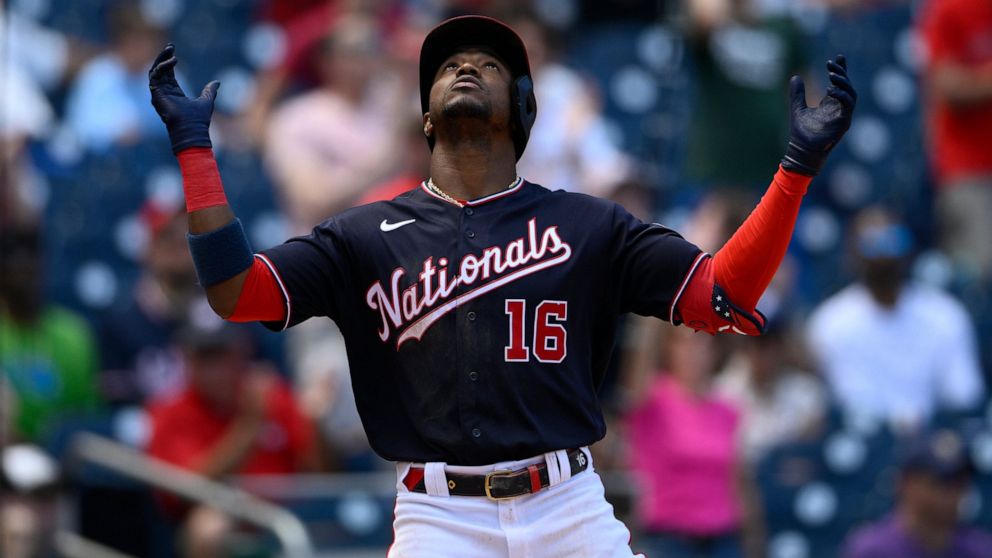 Washington Nationals' Victor Robles celebrates his three-run home run during the fourth inning of the first baseball game of a doubleheader against the Colorado Rockies, Saturday, May 28, 2022, in Washington. (AP Photo/Nick Wass)