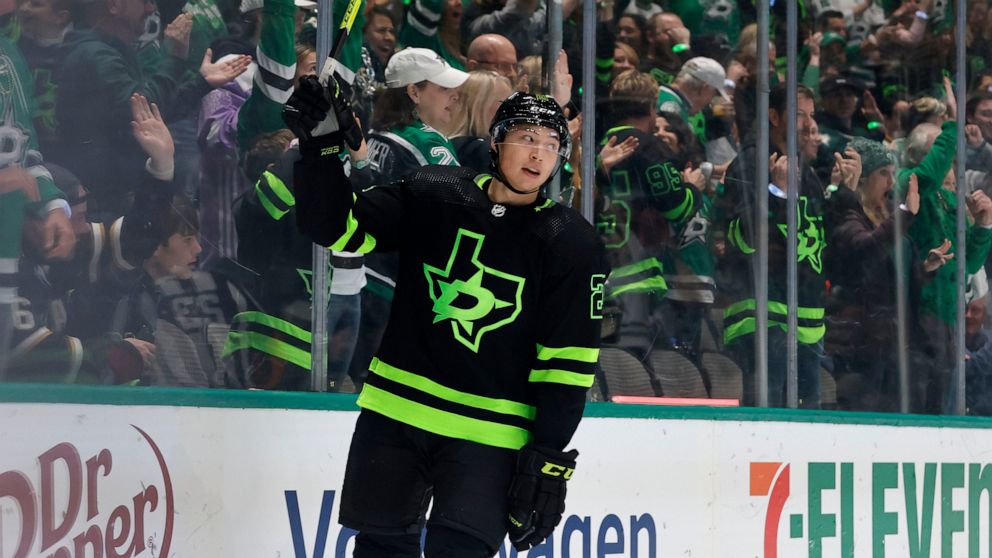 Dallas Stars left wing Jason Robertson (21) celebrates after his goal against the San Jose Sharks during the first period of an NHL hockey game in Dallas, Saturday, Dec. 31, 2022. (AP Photo/Michael Ainsworth)