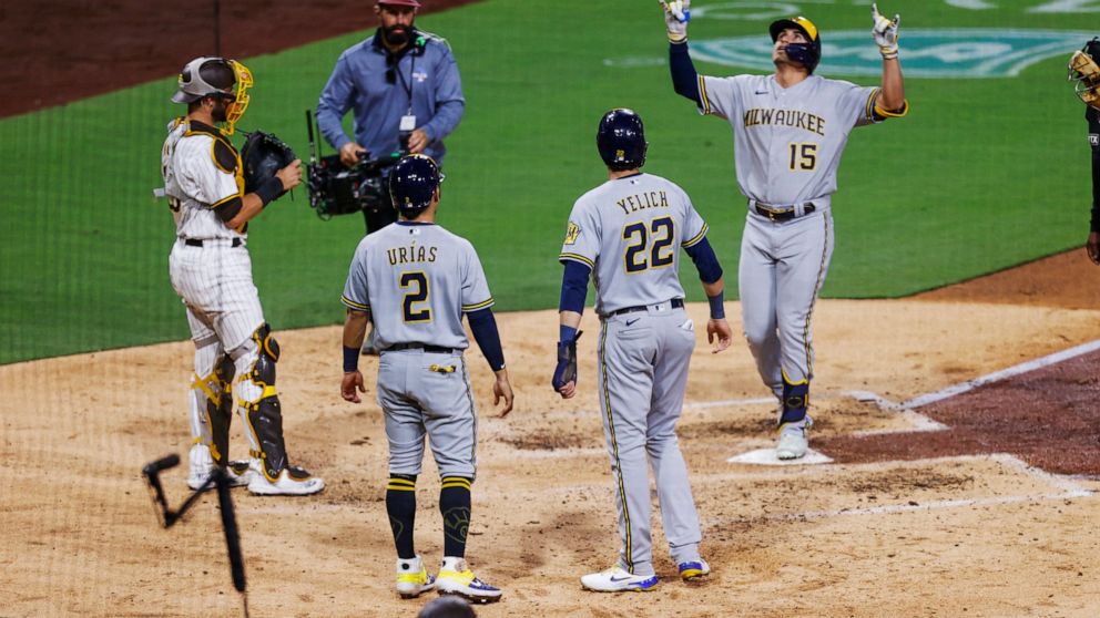 Milwaukee Brewers' Tyrone Taylor celebrates after hitting a three-run home run that scored Christian Yelich (22) and Luis Urias (2) against the San Diego Padres during the sixth inning of a baseball game Tuesday, May 24, 2022, in San Diego. (AP Photo
