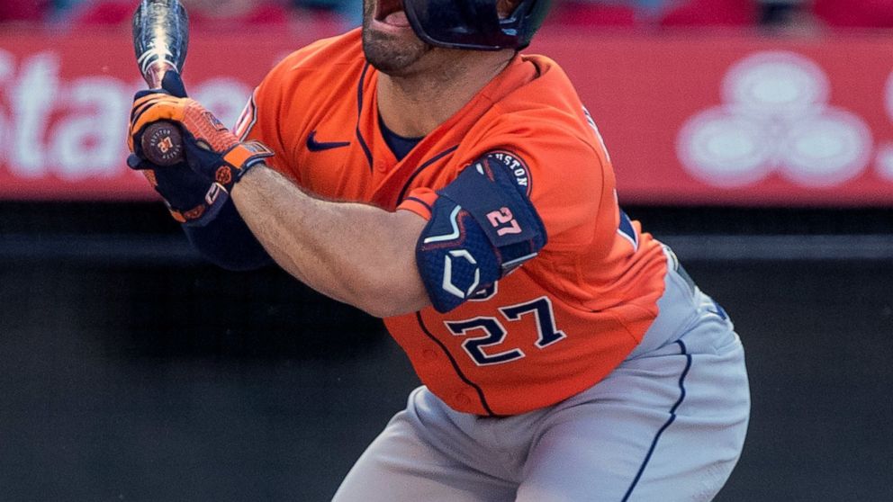 Houston Astros' Jose Altuve grimaces after being hit by a pitch during the first inning of the team's baseball game against the Los Angeles Angels in Anaheim, Calif., Thursday, July 14, 2022. (AP Photo/Alex Gallardo)