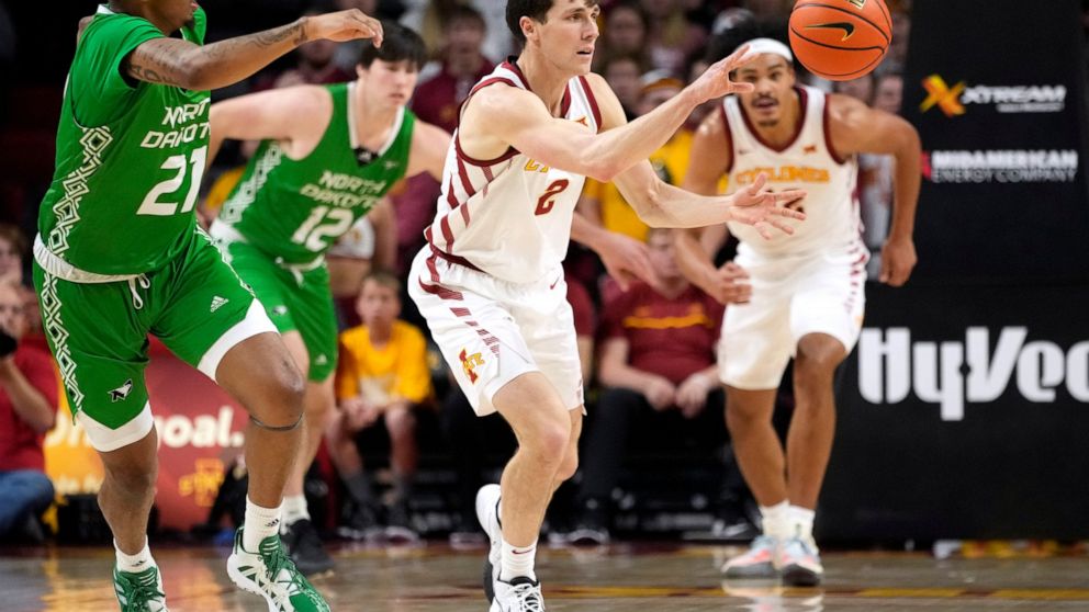 Iowa State guard Caleb Grill (2) steals the ball from North Dakota forward A'Jahni Levias (21) during the first half of an NCAA college basketball game, Wednesday, Nov. 30, 2022, in Ames, Iowa. (AP Photo/Charlie Neibergall)