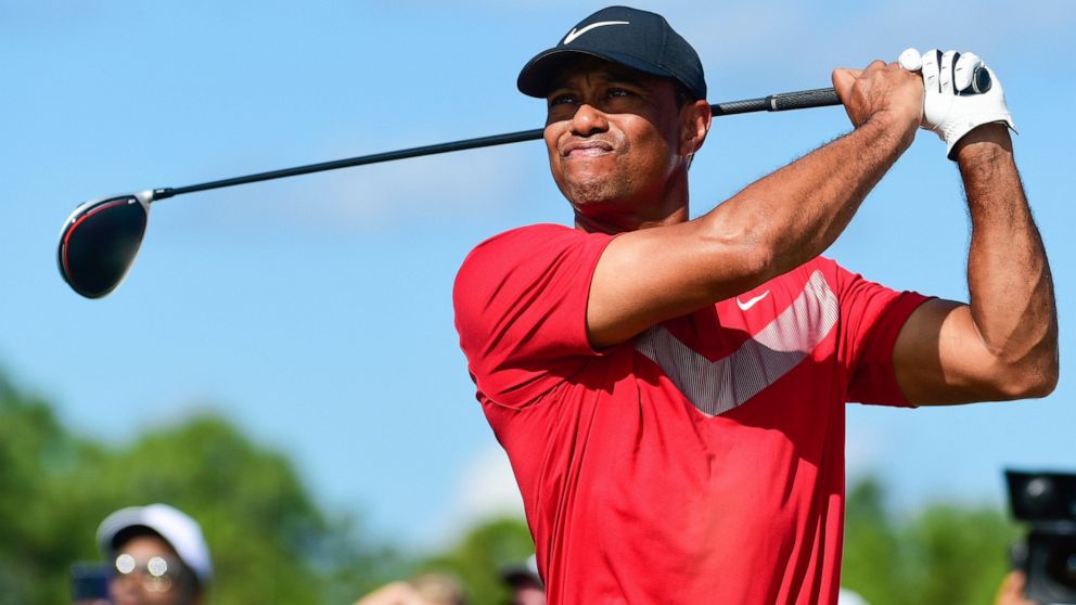 FILE - Tiger Woods follows his ball at the fourth tee during the last round of the Hero World Challenge at Albany Golf Club in Nassau, Bahamas, Saturday, Dec. 7, 2019. Tiger Woods has another loaded field for his Hero World Challenge in the Bahamas. 