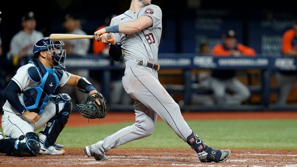 Houston Astros' Kyle Tucker (30) watches his two-run home run off Tampa Bay Rays relief pitcher Brooks Raley during the eighth inning of a baseball game Wednesday, Sept. 21, 2022, in St. Petersburg, Fla. Catching for the Rays is Rene Pinto. (AP Photo