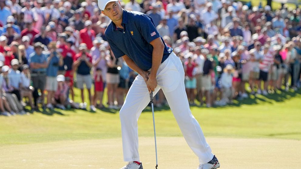 Jordan Spieth reacts to his putt on the 15th green during their foursomes match at the Presidents Cup golf tournament at the Quail Hollow Club, Saturday, Sept. 24, 2022, in Charlotte, N.C. (AP Photo/Chris Carlson)