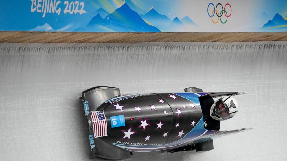 Elanta Meyers Taylor, of the United States, drives her bobsled during a women's monobob training heat at the 2022 Winter Olympics, Thursday, Feb. 10, 2022, in the Yanqing district of Beijing. (AP Photo/Mark Schiefelbein)