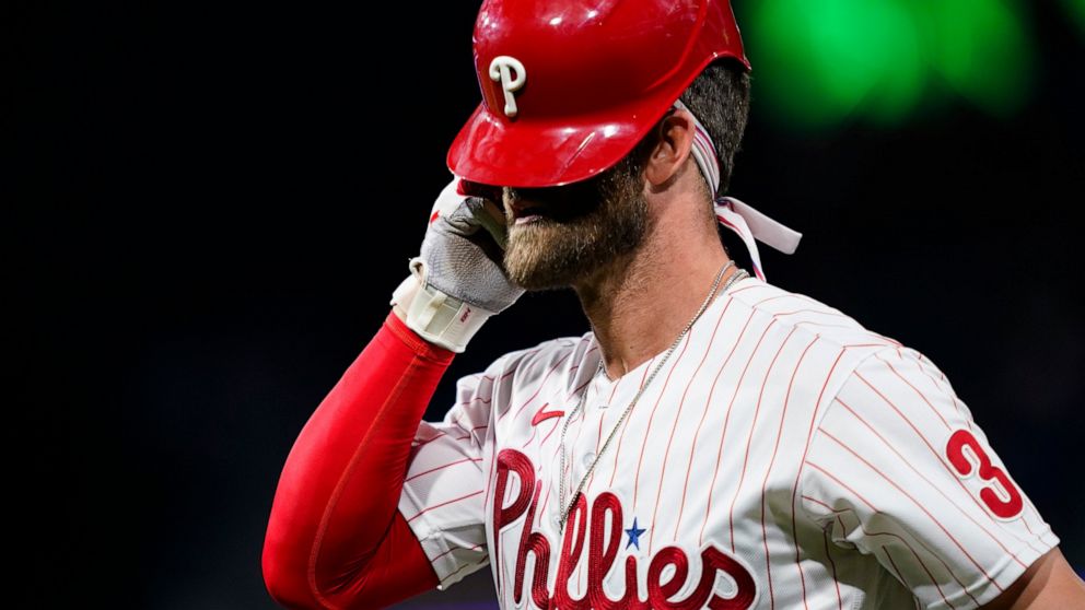 Philadelphia Phillies' Bryce Harper reacts after grounding out against San Francisco Giants pitcher Tyler Rogers during the seventh inning of a baseball game, Tuesday, May 31, 2022, in Philadelphia. (AP Photo/Matt Slocum)