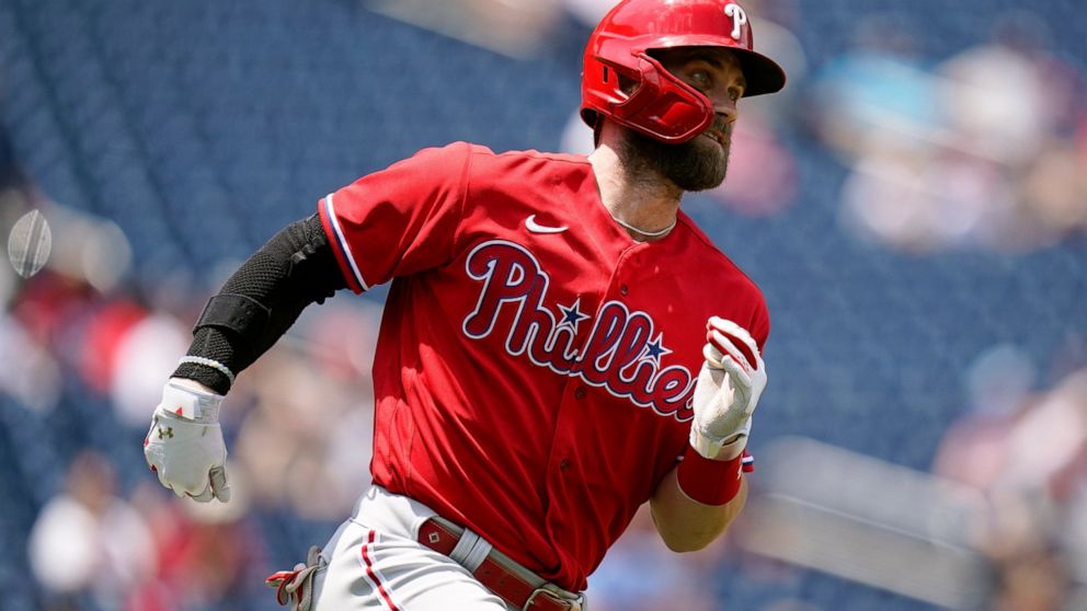 Philadelphia Phillies designated hitter Bryce Harper singles in the third inning of the first game of a baseball doubleheader against the Washington Nationals, Friday, June 17, 2022, in Washington. (AP Photo/Patrick Semansky)