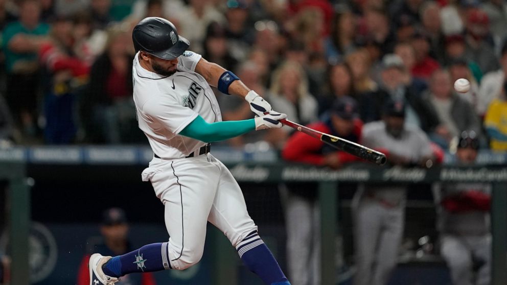 Seattle Mariners' Abraham Toro hits an RBI-double during the seventh inning of the team's baseball game against the Boston Red Sox, Saturday, June 11, 2022, in Seattle. (AP Photo/Ted S. Warren)