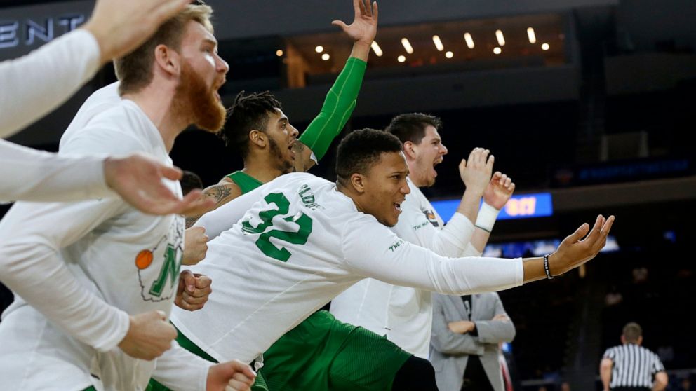 FILE - In this Saturday, March 10, 2018, file photo, then-Marshall guard Phil Bledsoe (32) and the Marshall bench react to a 3-point shot against Western Kentucky during the second half of the NCAA Conference USA basketball championship game in Frisc