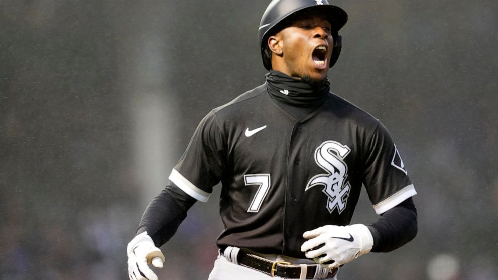 In a misting rain Chicago White Sox's Tim Anderson yells out in celebration of his home run off Chicago Cubs relief pitcher Keegan Thompson during the third inning of a baseball game Tuesday, May 3, 2022, in Chicago. (AP Photo/Charles Rex Arbogast)