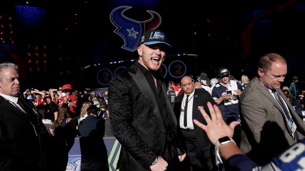 Michigan defensive end Aidan Hutchinson celebrates after being selected by the Detroit Lions as the second pick in the NFL football draft Thursday, April 28, 2022, in Las Vegas. (AP Photo/Jae C. Hong)
