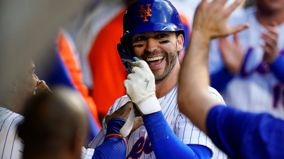 New York Mets' Tyler Naquin celebrates with teammates after hitting a home run during the second inning of the team's baseball game against the Atlanta Braves on Thursday, Aug. 4, 2022, in New York. (AP Photo/Frank Franklin II)