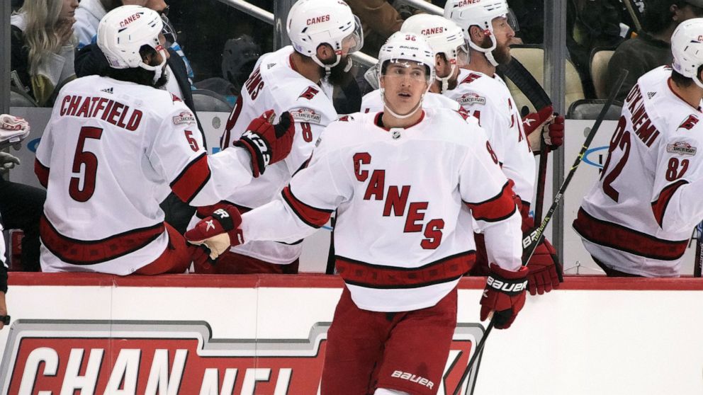 Carolina Hurricanes' Martin Necas returns to the bench after scoring during the second period of an NHL hockey game against the Pittsburgh Penguins in Pittsburgh, Tuesday, Nov. 29, 2022. (AP Photo/Gene J. Puskar)