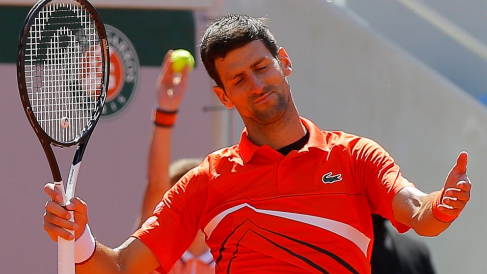 Serbia's Novak Djokovic reacts after missing a shot against Austria's Dominic Thiem in their semifinal match of the French Open tennis tournament at the Roland Garros stadium in Paris, Saturday, June 8, 2019. (AP Photo/Michel Euler)