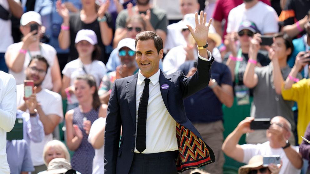 FILE - Switzerland's Roger Federer waves during a 100 years of Centre Court celebration on day seven of the Wimbledon tennis championships in London, on July 3, 2022. Federer announced Thursday, Sept. 15, 2022 he is retiring from tennis. (AP Photo/Ki