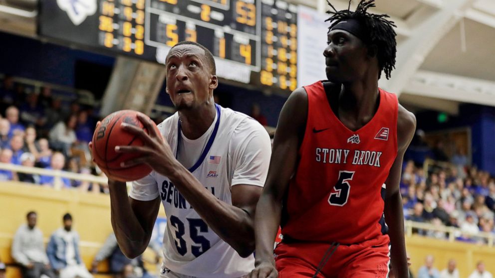 Seton Hall center Romaro Gill (35) drives to the basket past Stony Brook forward Mouhamadou Gueye (5) during the second half of an NCAA college basketball game, Saturday, Nov. 9, 2019, in South Orange, N.J. Seton Hall won 74-57. (AP Photo/Adam Hunger)