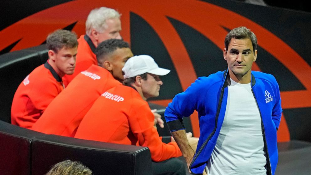 Team Europe's Roger Federer of Switzerland, waves during the match of Team Europe's Casper Ruud against Team World's Jack Sock on day one of the Laver Cup tennis tournament at the O2 in London, Friday, Sept. 23, 2022. (AP Photo/Kin Cheung)