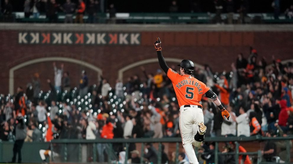 San Francisco Giants' Mike Yastrzemski runs the bases after hitting a grand slam against the Milwaukee Brewers during the ninth inning of a baseball game in San Francisco, Friday, July 15, 2022. The Giants won 8-5. (AP Photo/Godofredo A. Vásquez)