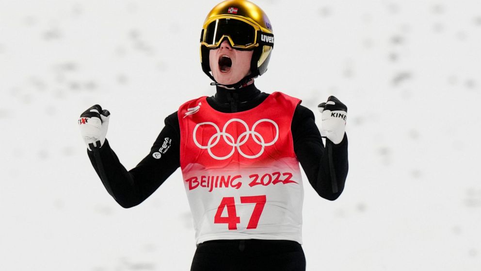 Gold medal winner Marius Lindvik, of Norway, reacts after his jump during a men's large hill individual final at the 2022 Winter Olympics, Saturday, Feb. 12, 2022, in Zhangjiakou, China. (AP Photo/Andrew Medichini)
