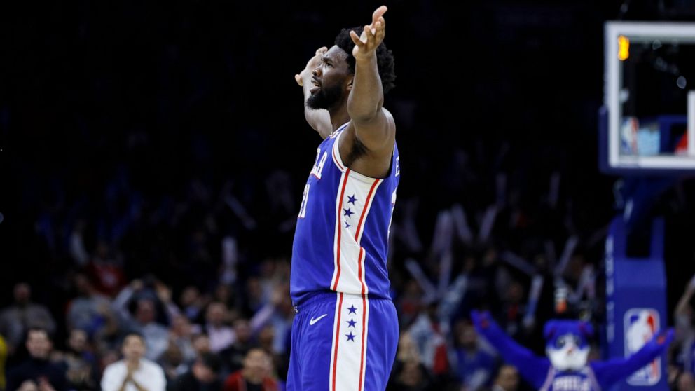 Philadelphia 76ers' Joel Embiid celebrates after making a basket during the second half of an NBA basketball game against the Denver Nuggets, Tuesday, Dec. 10, 2019, in Philadelphia. (AP Photo/Matt Slocum)