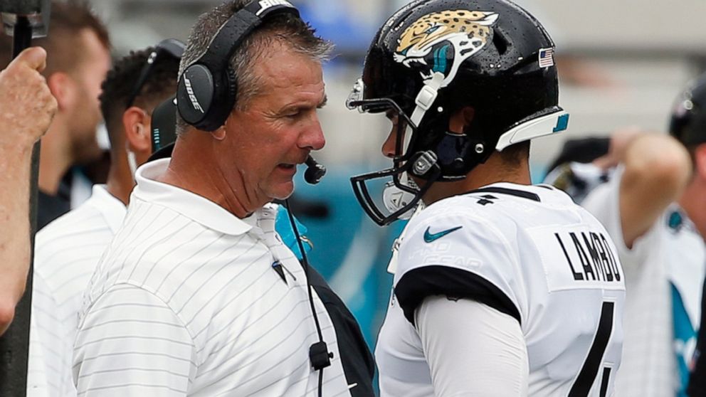 FILE - Jacksonville Jaguars head coach Urban Meyer, left, talks with place kicker Josh Lambo after Lambo missed his second field goal against the Denver Broncos during the first half of an NFL football game, Sunday, Sept. 19, 2021, in Jacksonville, F