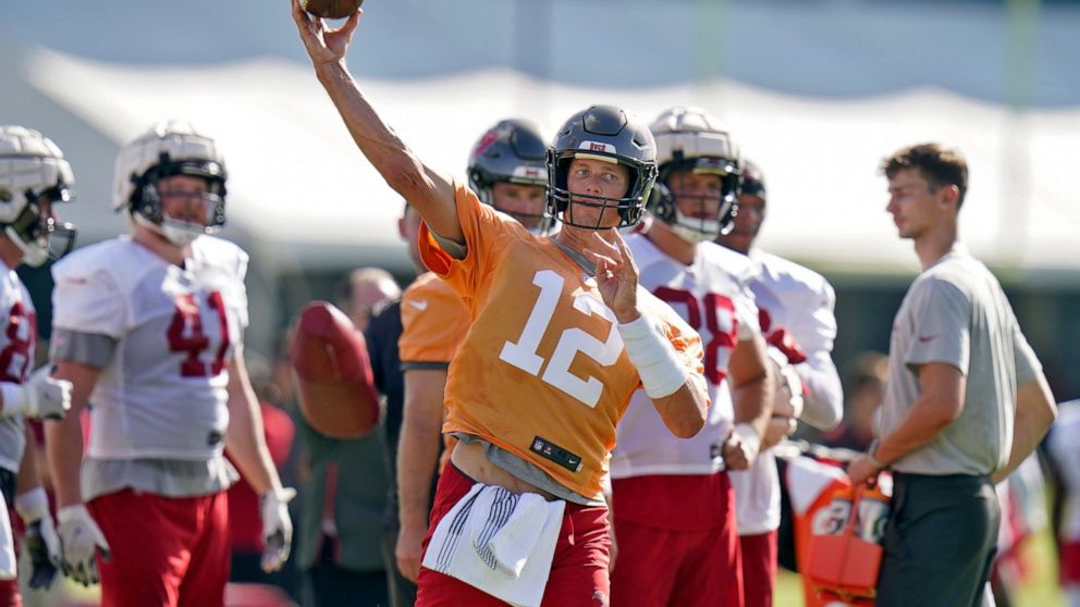 Tampa Bay Buccaneers quarterback Tom Brady throws a pass during an NFL football training camp practice Saturday, July 30, 2022, in Tampa, Fla. (AP Photo/Chris O'Meara)