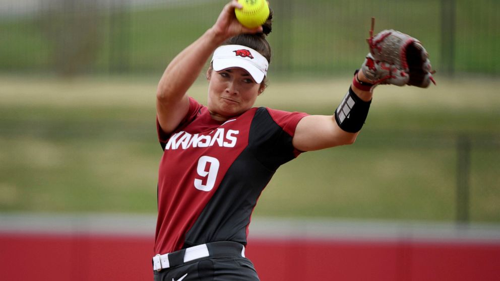 FILE - Arkansas pitcher Autumn Storms throws a pitch against Arkansas-Pine Bluff during an NCAA softball game on Tuesday, April 16, 2019 in Fayetteville, Ark. Arkansas did something rare during the 2017-18 and 2018-19 seasons: It watched its baseball