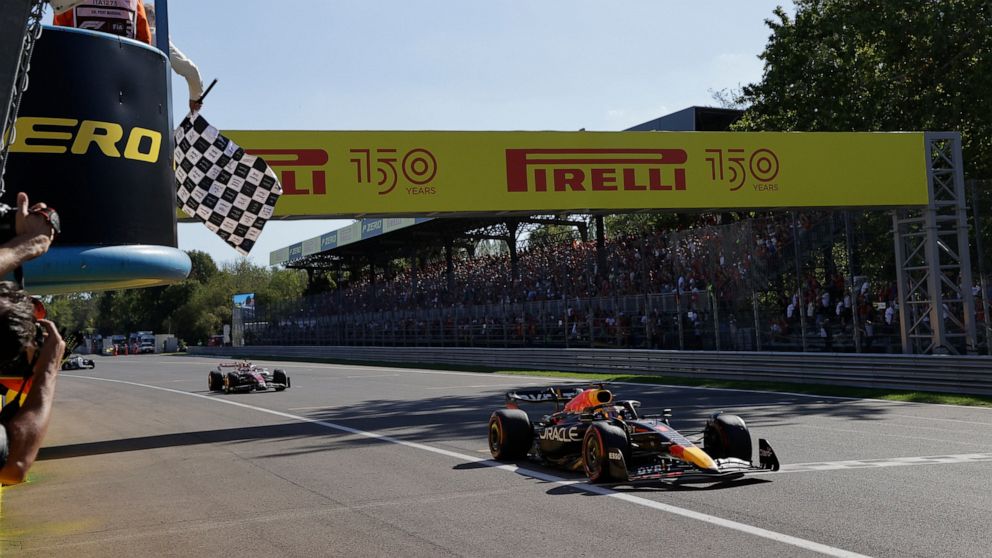 Red Bull driver Max Verstappen of the Netherlands crosses the finish line to win the Italian Grand Prix race at the Monza racetrack, in Monza, Italy, Sunday, Sept. 11, 2022. (AP Photo/Ciro De Luca, Pool via AP)