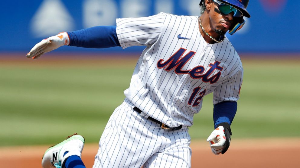 New York Mets' Francisco Lindor rounds the bases after hitting a home run against the Seattle Mariners during the first inning of a baseball game Sunday, May 15, 2022, in New York. (AP Photo/Noah K. Murray)