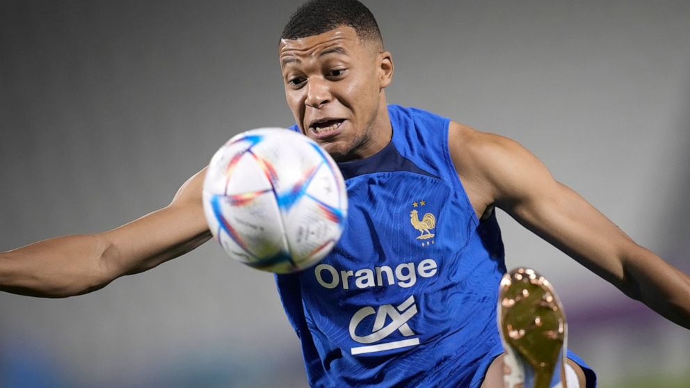 France's Kylian Mbappe controls the ball during a training session at the Jassim Bin Hamad stadium in Doha, Qatar, Friday, Dec. 2, 2022. France will play in the World Cup against Poland on Dec. 4. (AP Photo/Christophe Ena)