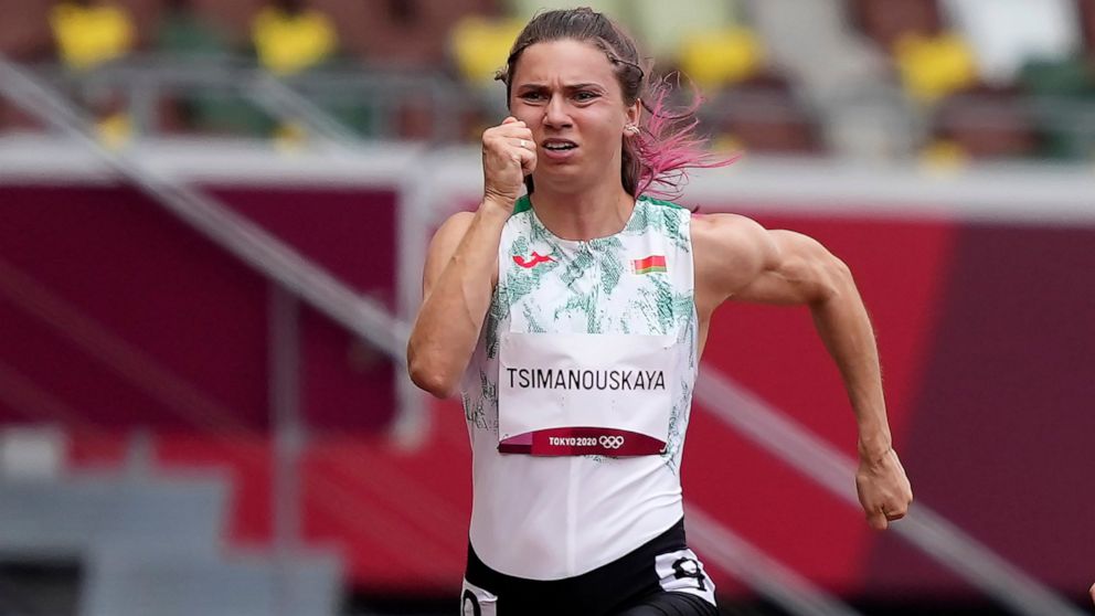 Krystsina Tsimanouskaya, of Belarus, runs in the women's 100-meter run at the 2020 Summer Olympics, Friday, July 30, 2021. Tsimanouskaya alleged her Olympic team tried to remove her from Japan in a dispute that led to a standoff Sunday, Aug. 1, at To