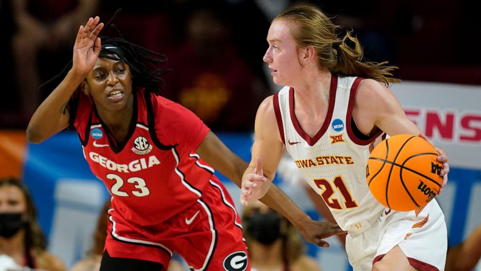 Iowa State guard Lexi Donarski (21) drives past Georgia guard Que Morrison (23) during the first half of a second-round game in the NCAA women's college basketball tournament, Sunday, March 20, 2022, in Ames, Iowa. (AP Photo/Charlie Neibergall)