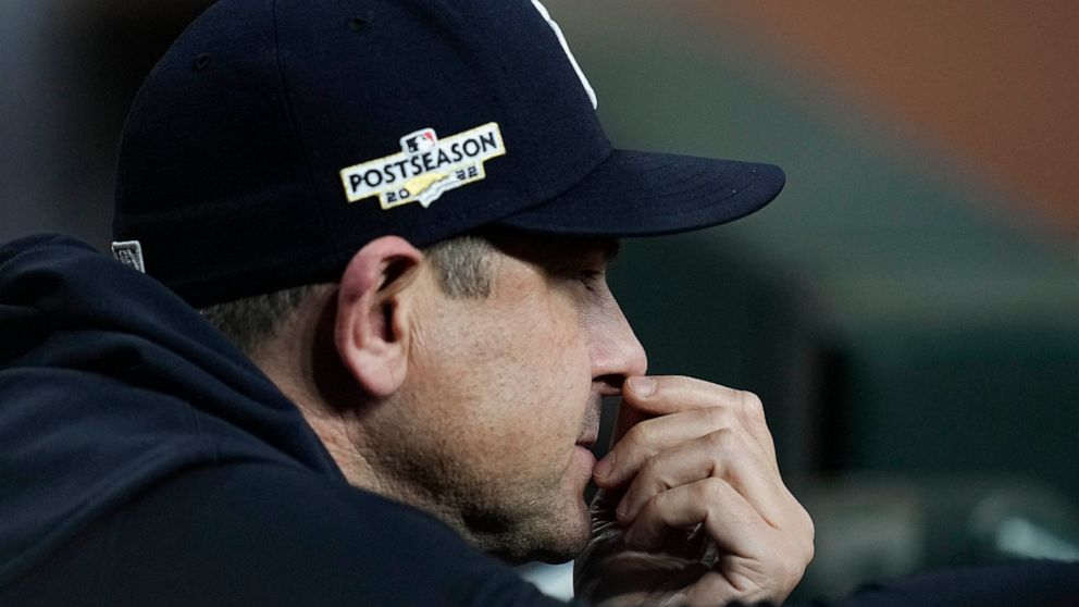 New York Yankees manager Aaron Boone watches play from the dugout during the ninth inning in Game 2 of baseball's American League Championship Series between the Houston Astros and the New York Yankees, Thursday, Oct. 20, 2022, in Houston. (AP Photo/