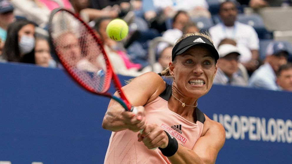 Angelique Kerber, of Germany, returns a shot to Sloane Stephens, of the United States, during the third round of the US Open tennis championships, Friday, Sept. 3, 2021, in New York. (AP Photo/Elise Amendola)