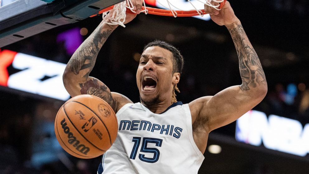 Memphis Grizzlies forward Brandon Clarke dunks the ball against the Charlotte Hornets during the first half of an NBA basketball game in Charlotte, N.C., Saturday, Feb. 12, 2022. (AP Photo/Jacob Kupferman)