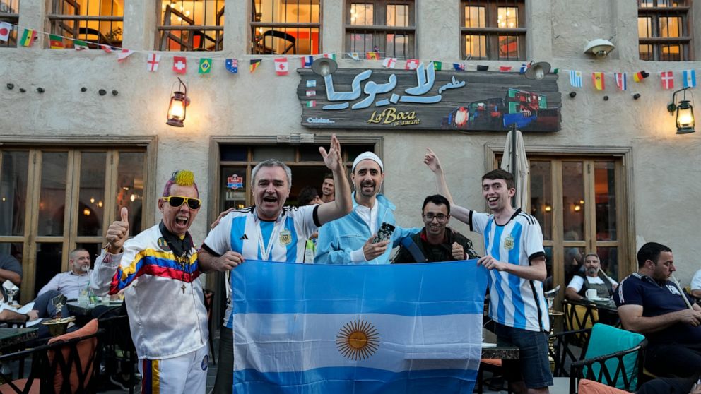 Fans of Argentina cheer for their team in Souq Waqif market in Doha, Qatar, Thursday, Dec. 15, 2022. Argentina will face France in the World Cup final match on Dec. 18. (AP Photo/Andre Penner)