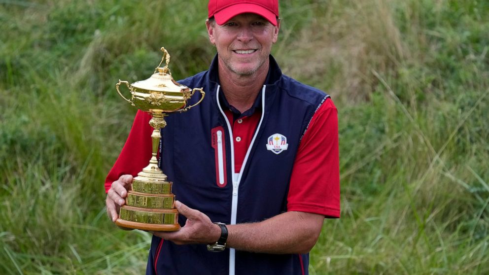 FILE - Team USA captain Steve Stricker poses with the trophy after the Ryder Cup matches at the Whistling Straits Golf Course, Sunday, Sept. 26, 2021, in Sheboygan, Wis. Stricker returns to competition this week on the PGA Tour Champions after a myst