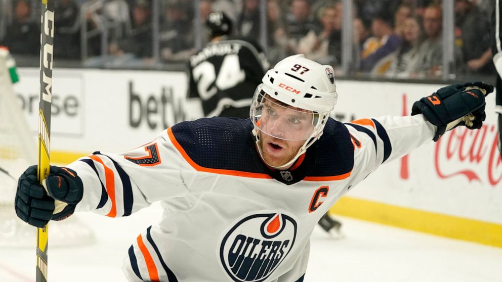 Edmonton Oilers center Connor McDavid celebrates after scoring during the first period of an NHL hockey game against the Los Angeles Kings Thursday, April 7, 2022, in Los Angeles. (AP Photo/Mark J. Terrill)