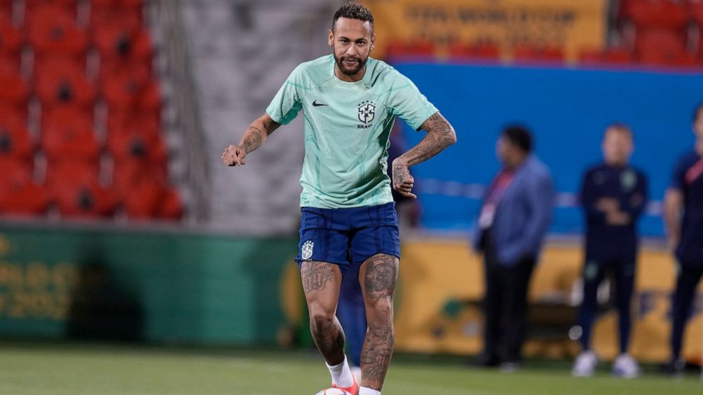 Brazil's Neymar practices during a training session at the Grand Hamad stadium in Doha, Qatar, Sunday, Dec. 4, 2022. Brazil will face South Korea in a World Cup round of 16 soccer match on Dec. 5. (AP Photo/Andre Penner)