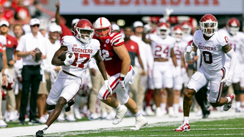 Oklahoma's Marvin Mims Jr. (17) carries a punt return against Nebraska during the first half of an NCAA college football game Saturday, Sept. 17, 2022, in Lincoln, Neb. (AP Photo/Rebecca S. Gratz)